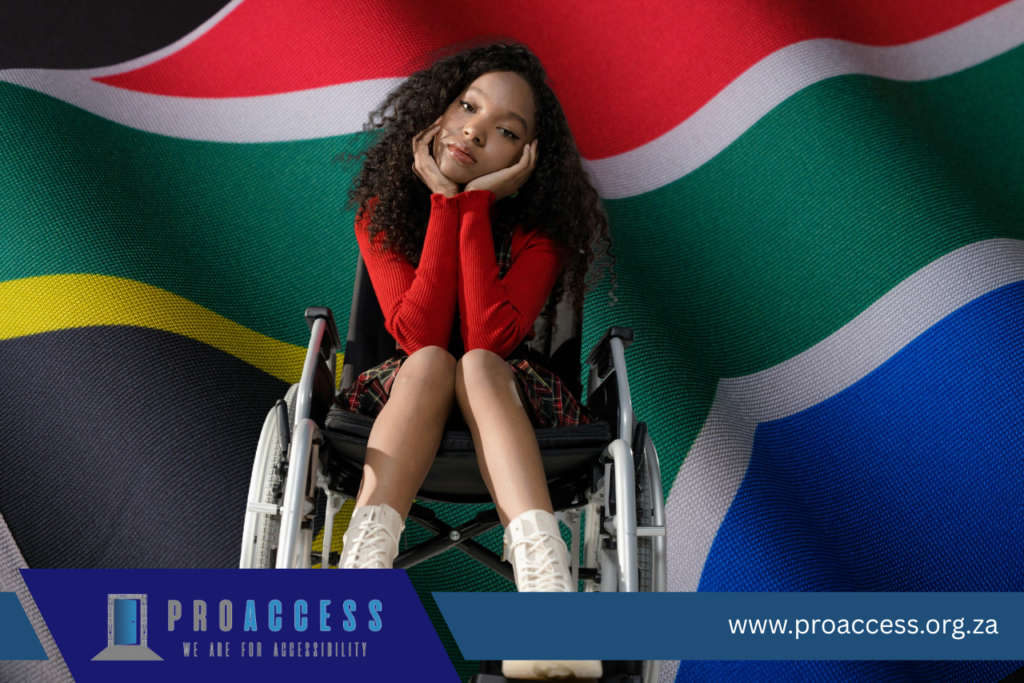 wheelchair user in front of a south african flag